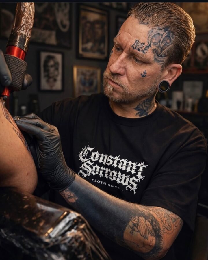 Charlie Edwards, tattoo artist at Grand Architect Tattoo Studio in Murrieta, California, tattooing a client