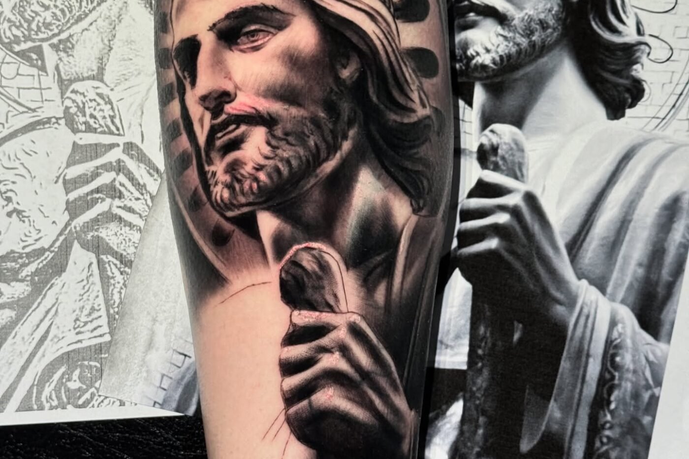 Black and grey religious portrait tattoo worked from a statue reference photograph