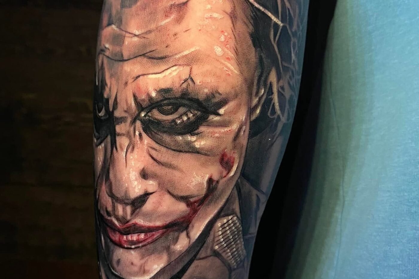 Portrait realism tattoo of the Joker on the forearm