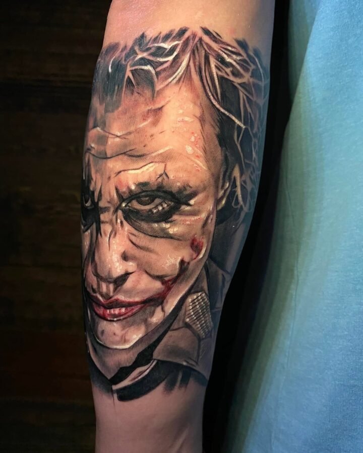 Portrait realism tattoo of the Joker on the forearm